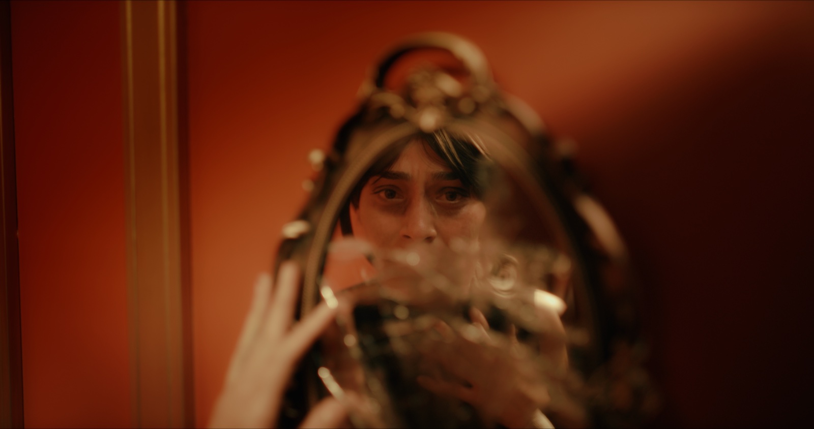 Seraphina’s reflection in an ornate hand mirror in the short film Always Enough