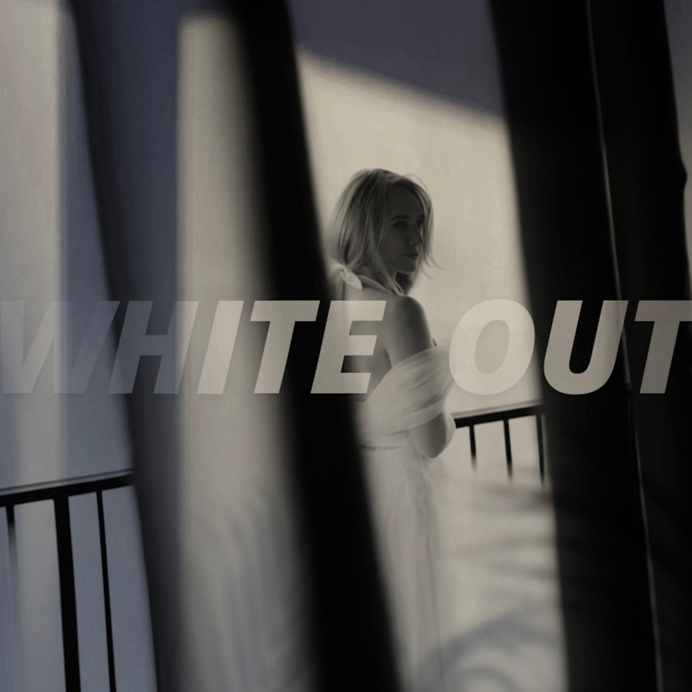 Single artwork for Lindsay Boven’s “Whiteout,” showing her in white on a balcony behind blurred vertical shapes with the title in white capitals