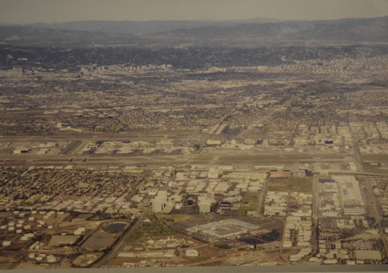 Aerial photo of the Los Angeles basin in the 1990s, flat city grid stretching toward the hills