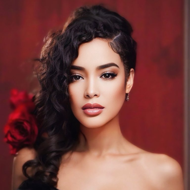 Portrait of R&B and pop singer Melissa B. in front of a red backdrop