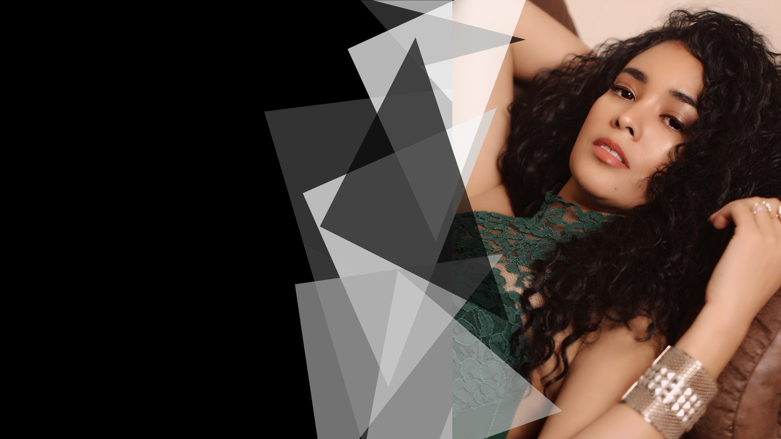 Melissa B. posing beside black and white geometric shapes
