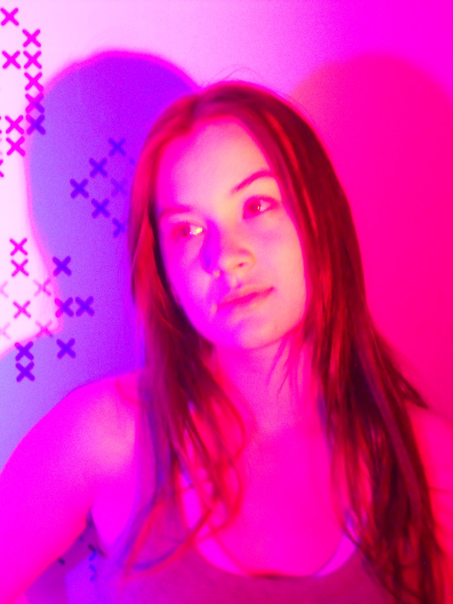 Alyson Indigo studio portrait under pink and purple light