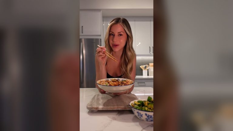 Christina Thornton at her kitchen counter with chopsticks and a bowl of pan dumplings