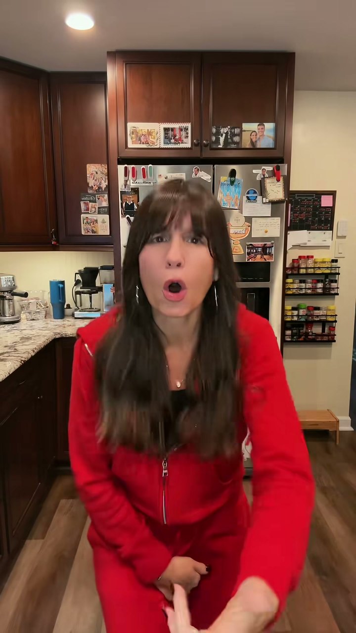 Devon Vander in a red velour tracksuit performing Eminem’s Soldier
