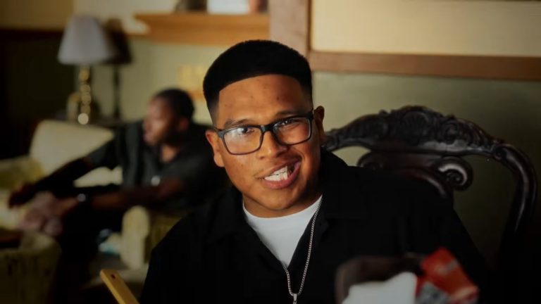 EGR, Christian rapper from Stockton, smiling in the Big Brother remix video
