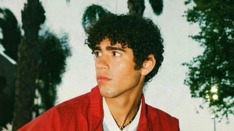 Eli Youngblood, rapper from southern Indiana, in a red jacket