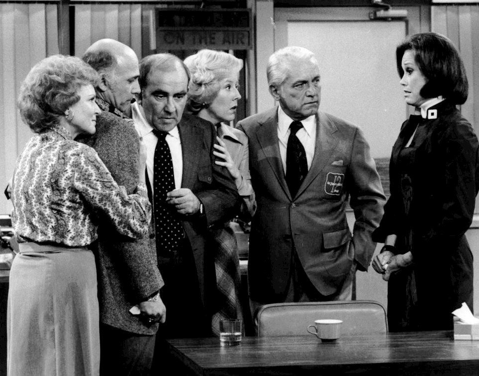 The cast of The Mary Tyler Moore Show in the WJM newsroom set, 1977