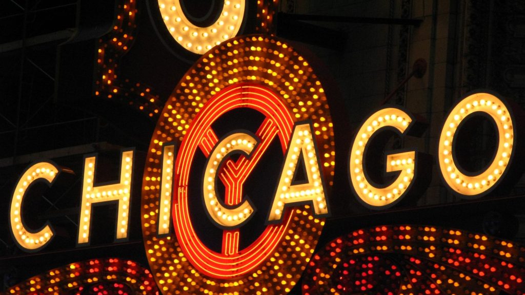The lit-up Chicago Theatre sign on State Street at night