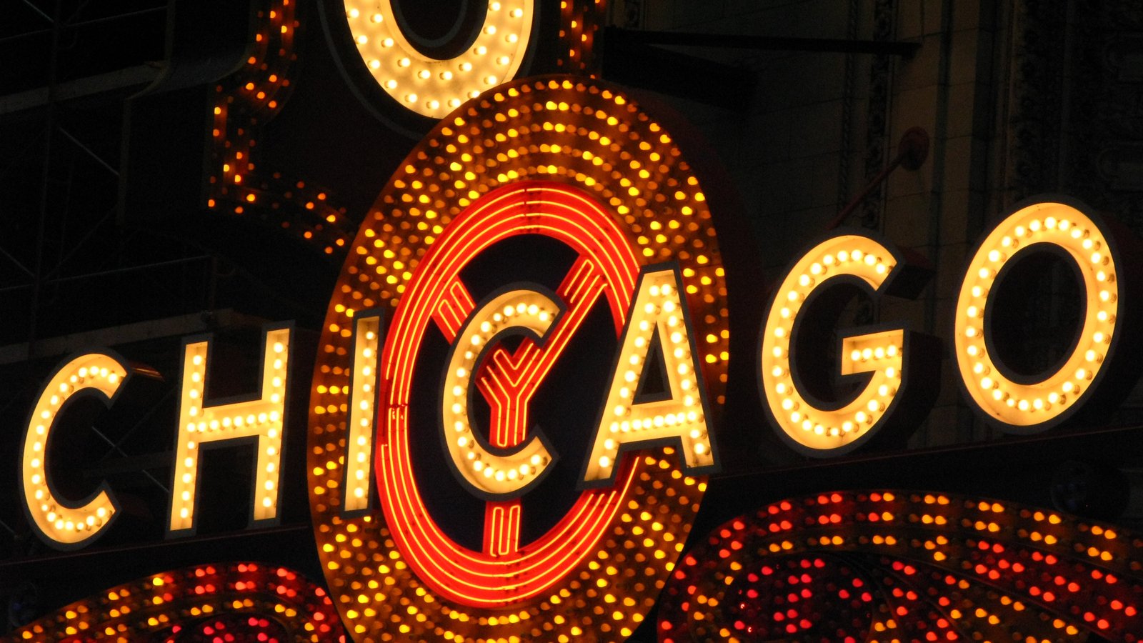 The lit-up Chicago Theatre sign on State Street at night