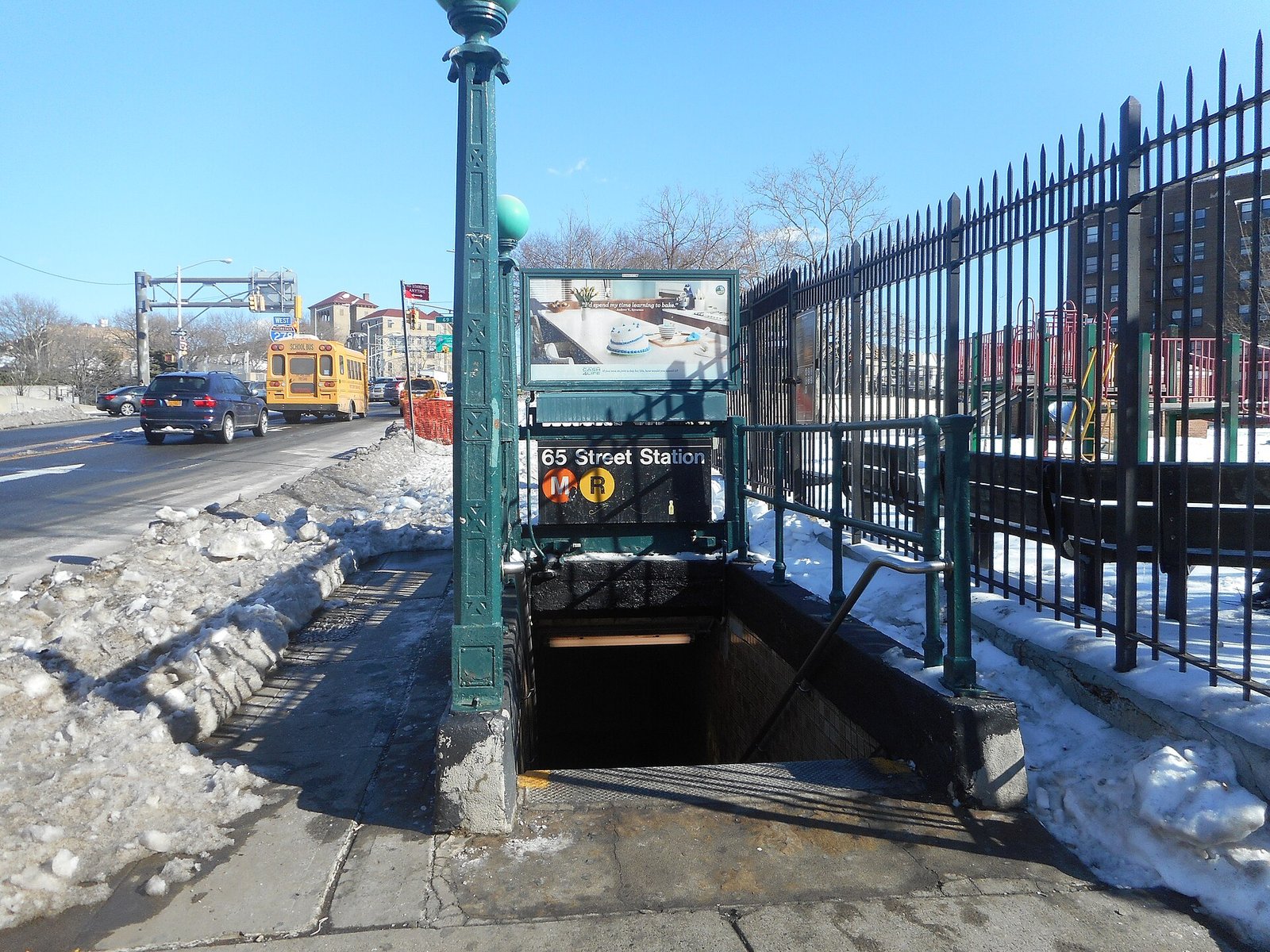 A subway station entrance on Broadway at 65th Street in Queens, New York