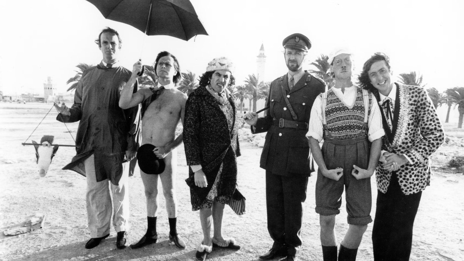 The six members of Monty Python posing on a beach in Tunisia, 1978