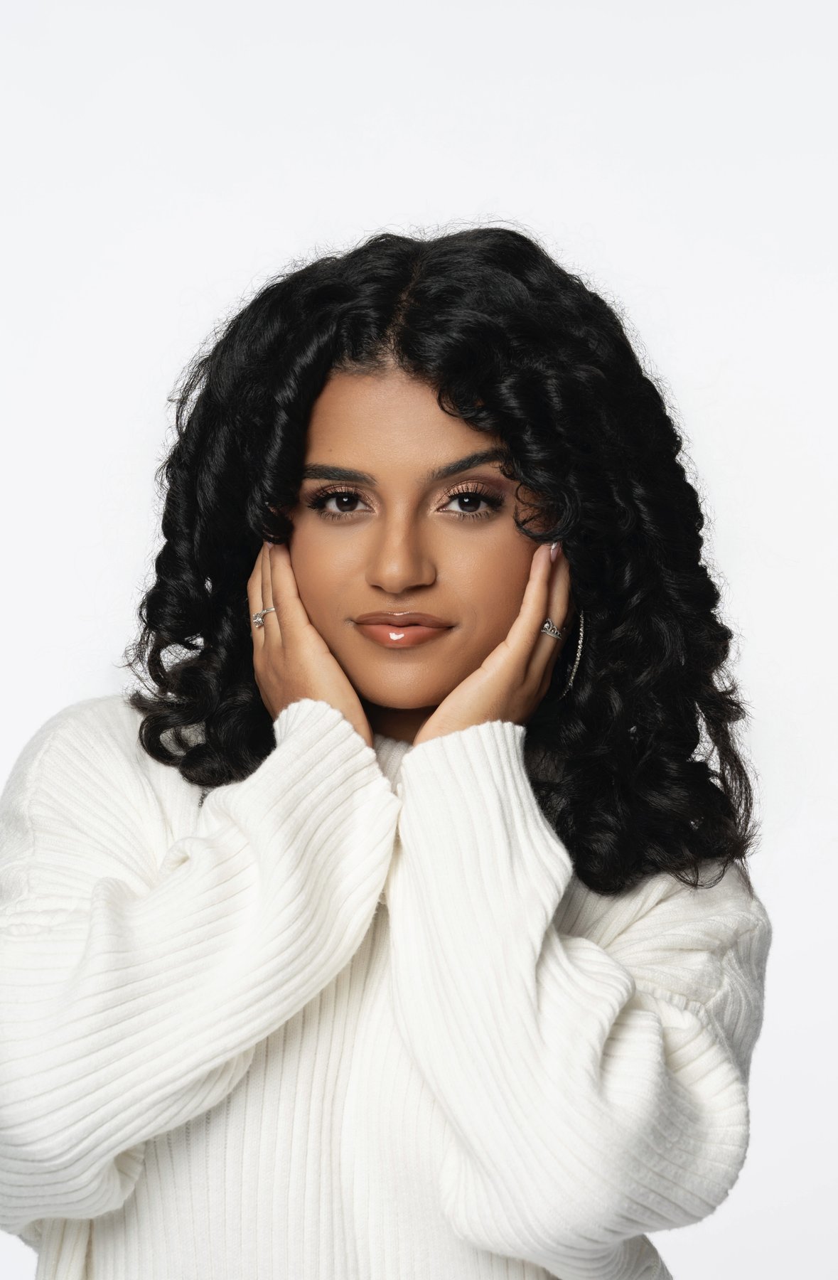 Headshot of singer-songwriter Nikki Nicole in a white sweater