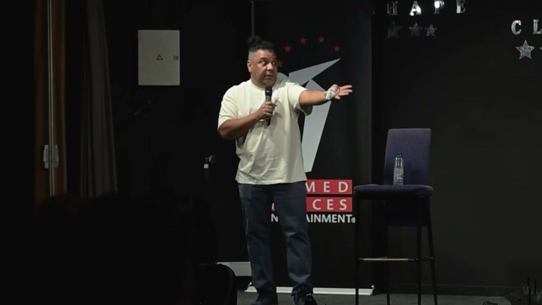 Orlando Leyba performing stand-up for troops on the Armed Forces Entertainment stage at SHAPE in Belgium, 2026