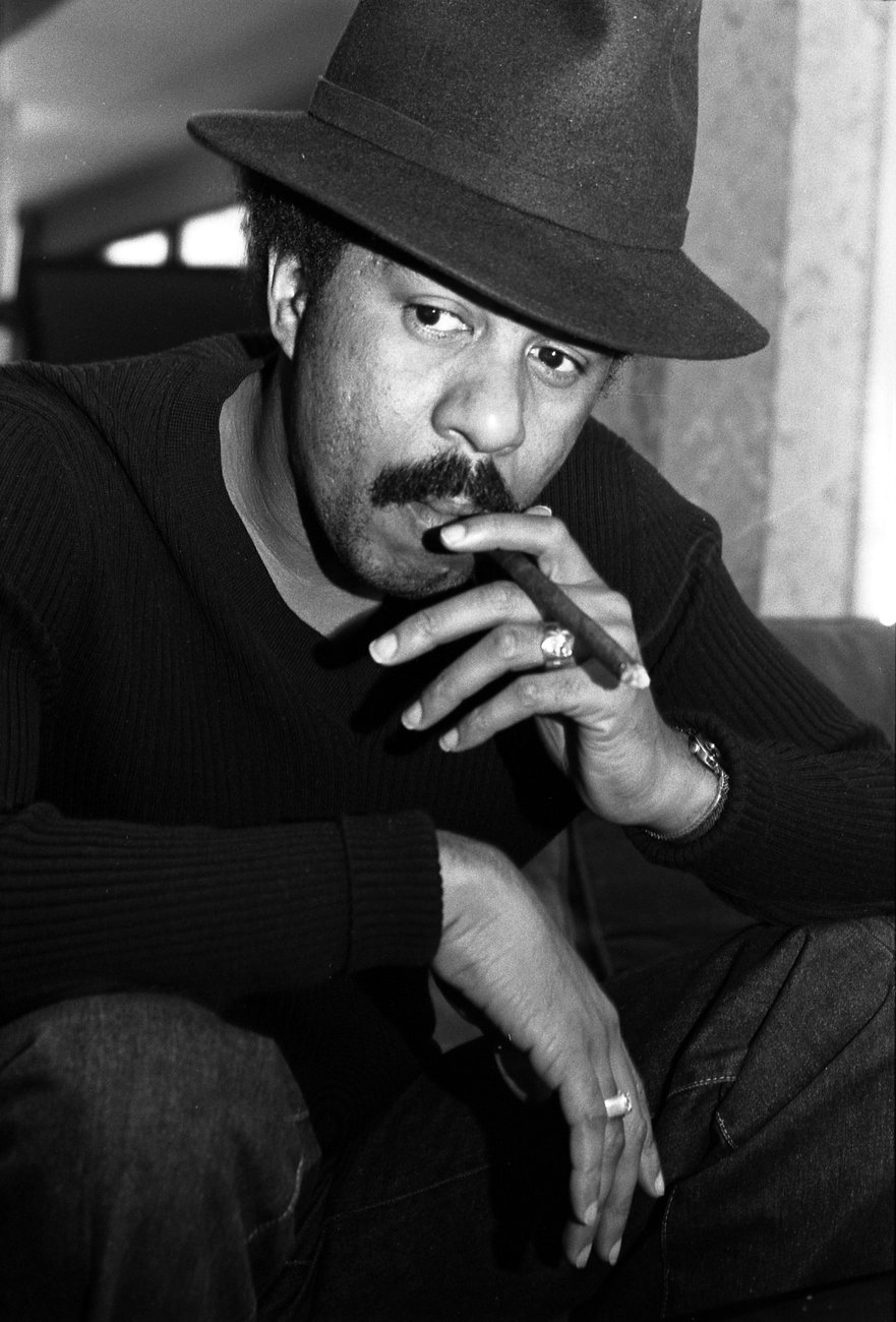 Richard Pryor seated in a fedora, 1976