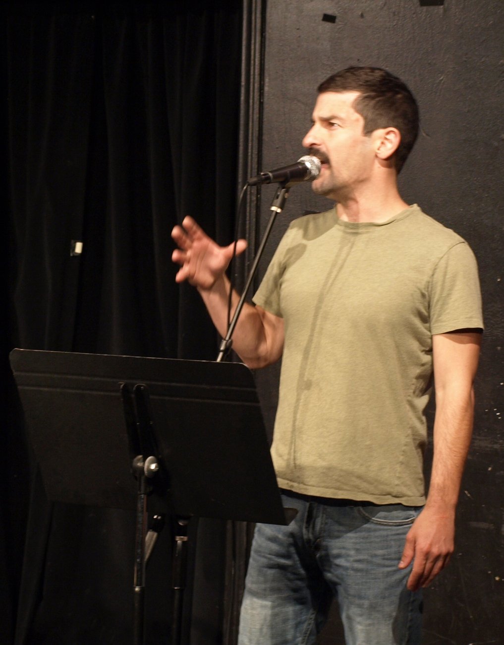 A comedian performing stand-up at the Upright Citizens Brigade Theatre in Los Angeles
