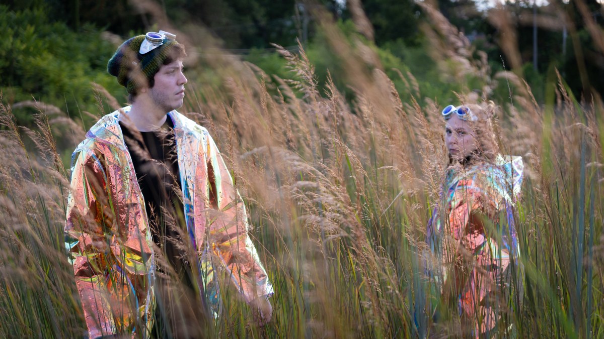 VIRID band members Olivia Cirisan and Ancel Fitzgerald Neeley in tall grass