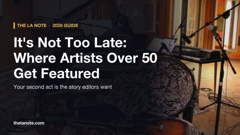 A recording studio live room with a grand piano, keyboards and a guitar case